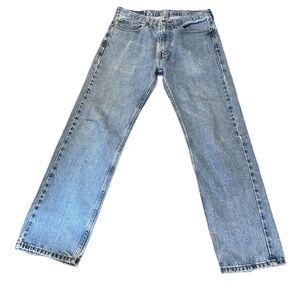 Levi's Men's 505 Blue Jeans. Size 34/32 distressed with custom inside patches.